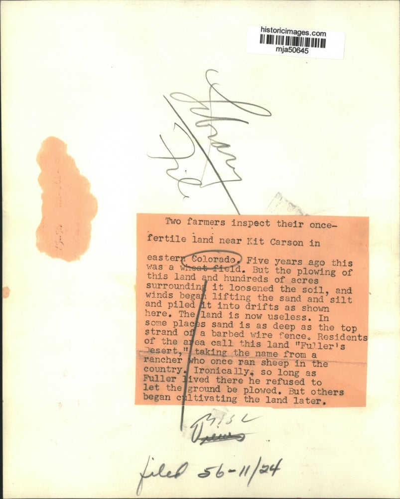 1956 Press Photo Two farmers inspect land near Kit Carson in eastern Colorado