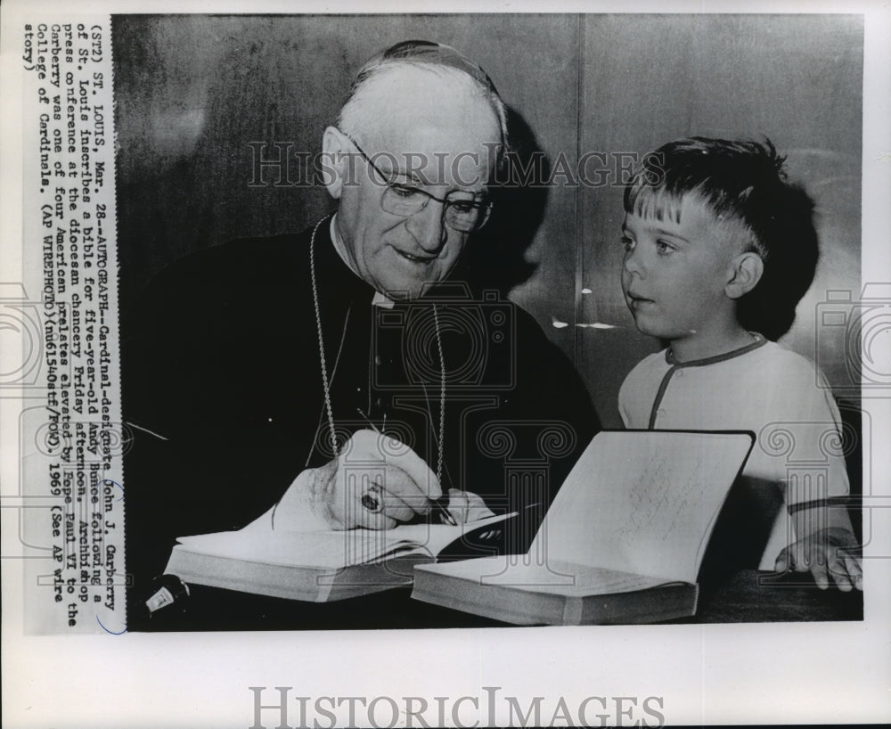 1969 Press Photo Archbishop John J. Carberry, Inscribes Bible for Andy Bunce- Historic Images