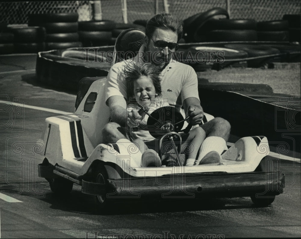 1984 Press Photo Paul Westin Driving Daughter on Go-Cart at Johnson Park - Historic Images