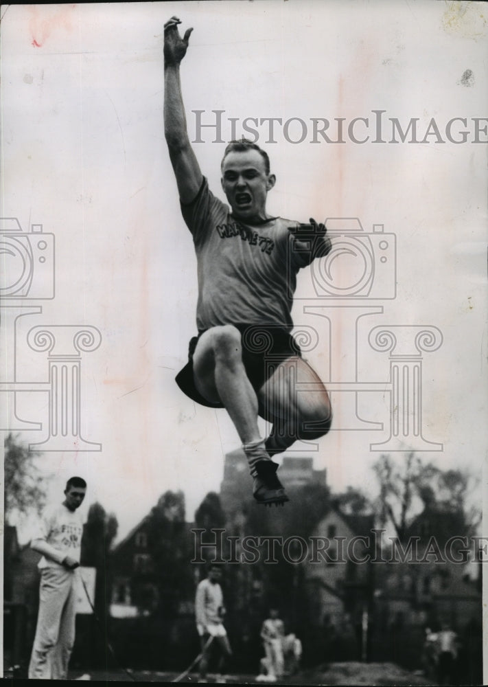 1953 Press Photo John Bennett Jumping 23 Feet at Marquette Stadium - mja65892- Historic Images
