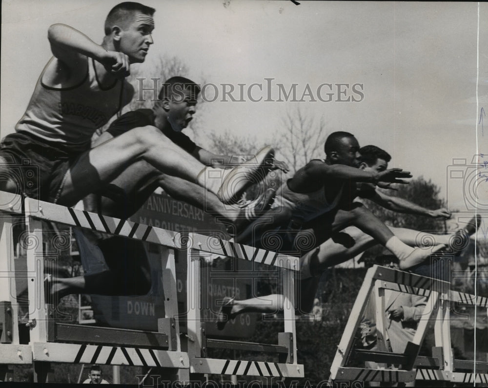 1956 Press Photo High Hurdle Dual Track Meet Between Marquette and Notre Dame- Historic Images