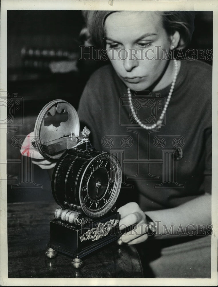 1964 Press Photo Girl Showing Off an Antique Night Clock, with small oil lamp- Historic Images