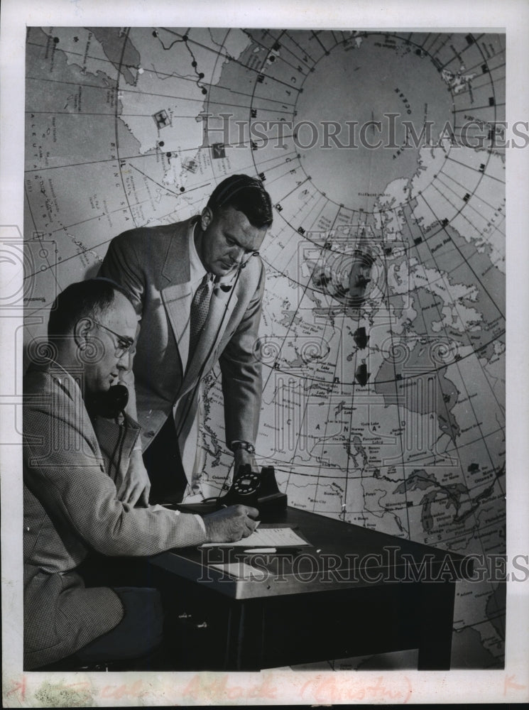 1955 Press Photo Harry E. Roderik and Clark Nesbitt check with an attack warning