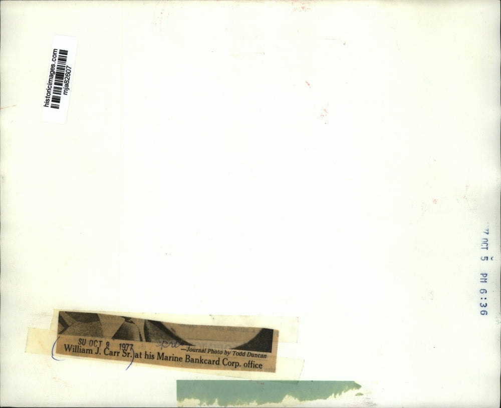 1977 Press Photo President of Marine Bankcard Corp. William Carr in His Office