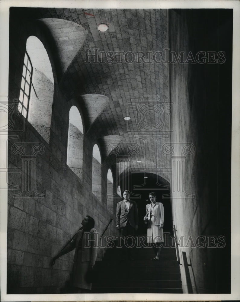 1947 Press Photo Visitors on medieval stairway lit by natural and electric light- Historic Images