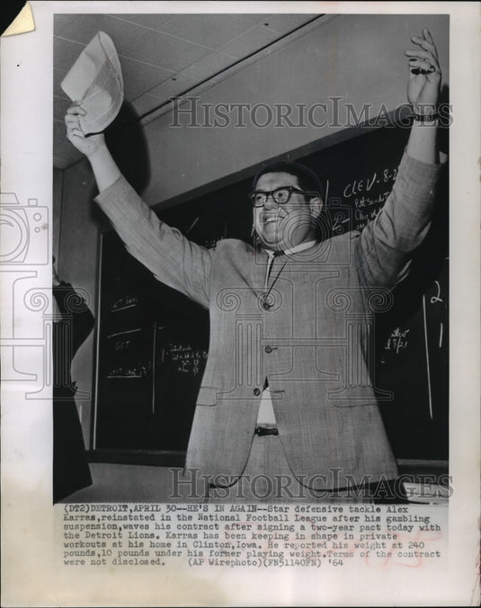 1964 Press Photo Detroit Lions Football Player Alex Karras waves new contract- Historic Images
