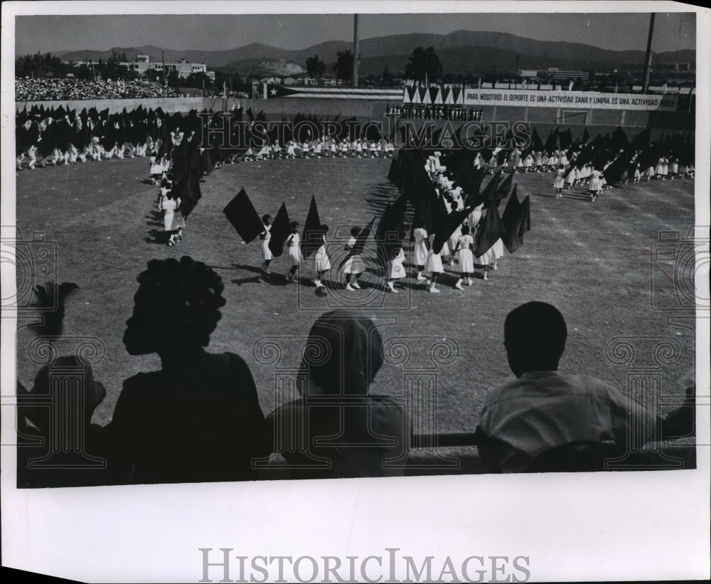 1964 Press Photo Girls waving red flags in Cuba- Historic Images