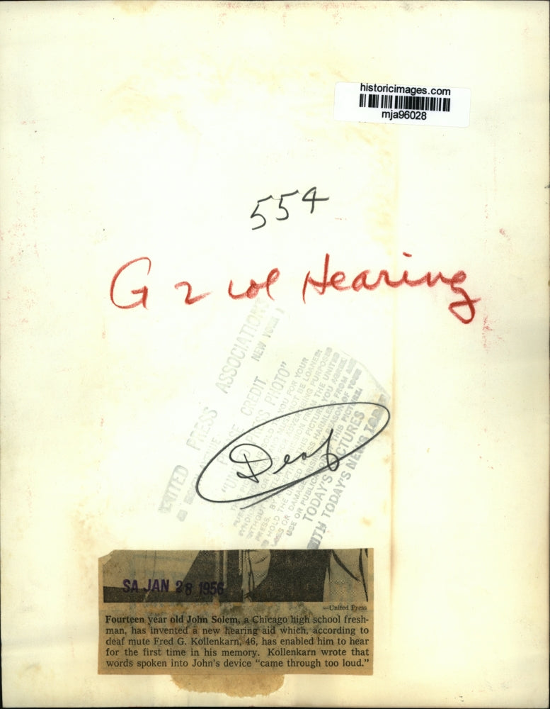 1956 Press Photo John Solem, Fred Kollenkarn testing new hearing aid device.