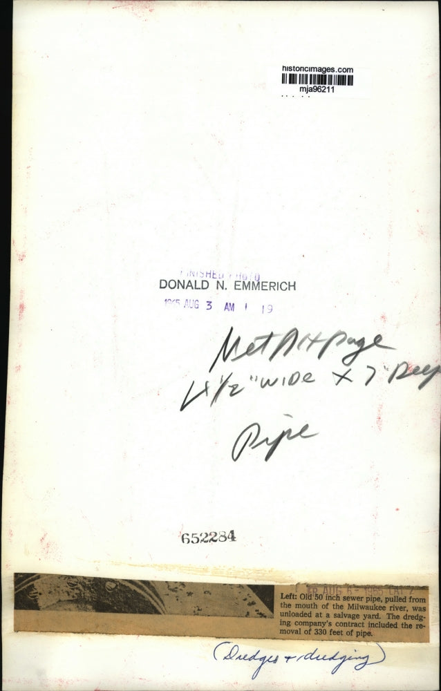 1965 Press Photo Old 50 inch sewer pipe pulled from the Milwaukee river