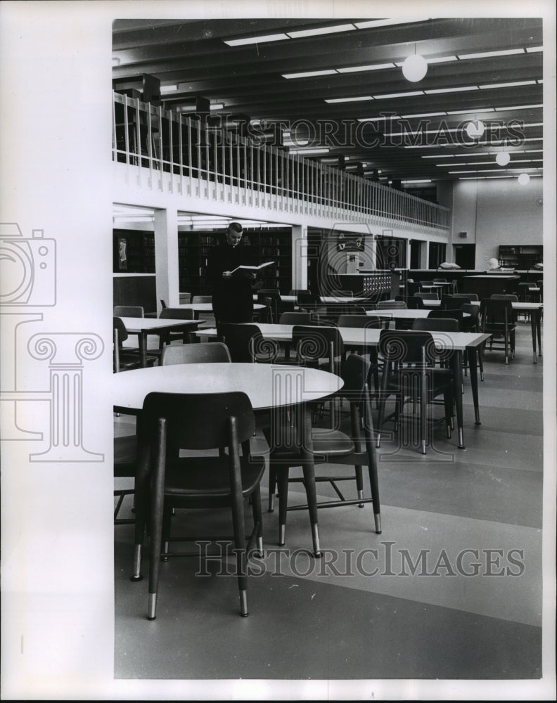 1963 Press Photo Father Michael Murphy in the library at the De Sales seminary- Historic Images