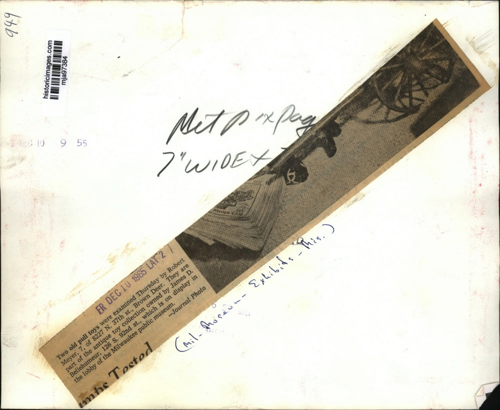 1965 Press Photo Robert Meyer observes antique toys at Milwaukee Museum