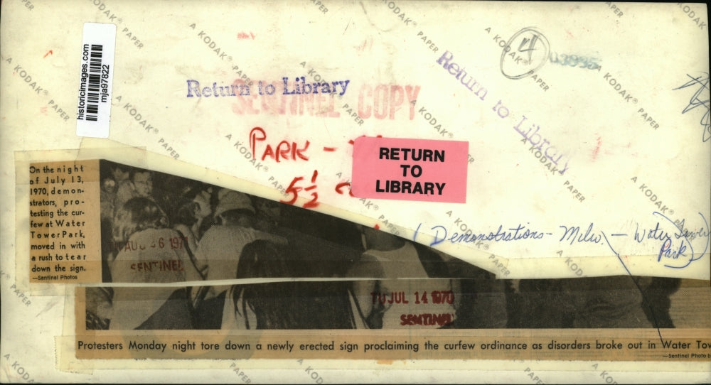 1970 Press Photo Protesters tear down a sign at Water Tower Park in Milwaukee