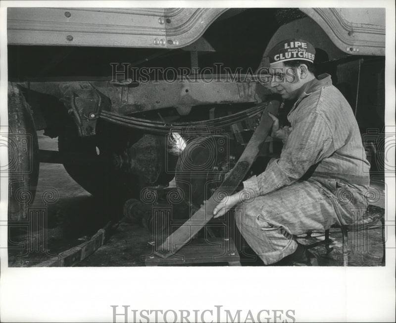 Load image into Gallery viewer, 1972 Press Photo Mechanic Looking At Train Part In Need of Repair, 1960s
