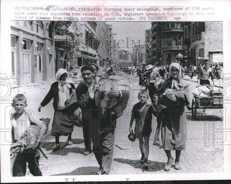 Load image into Gallery viewer, 1963 Press Photo Refugees of Earthquake Leave the Ruins of Skopue, Yugoslavia
