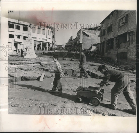 1960 Press Photo Two boys drag potato wagon along Castro's main street- Historic Images