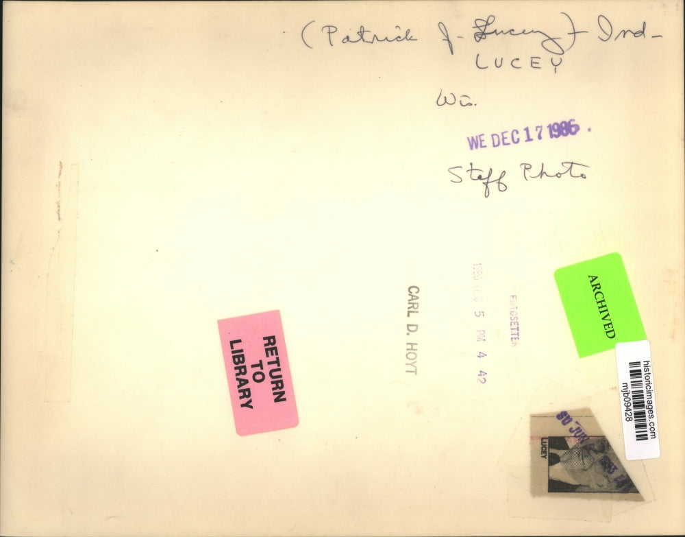 1986 Press Photo Patrick J. Lucey standing in front of Artwork in Suit