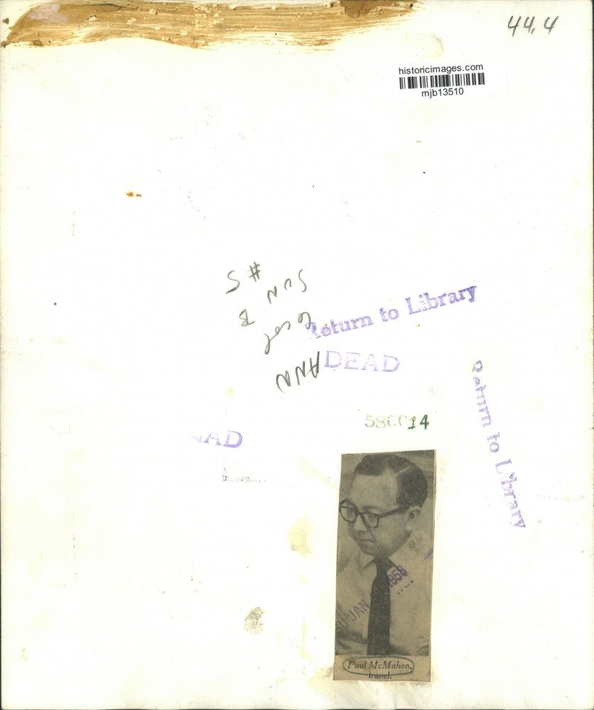 1958 Press Photo Paul McMahon reads newspaper - mjb13510