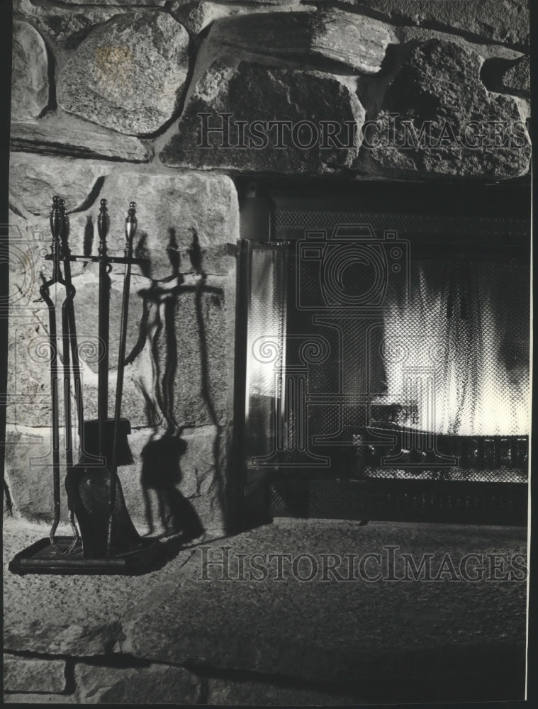  Press Photo Large stone fireplace with cozy fire- Historic Images