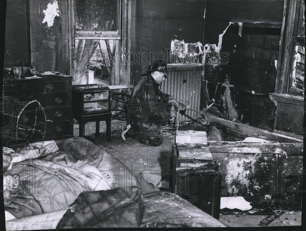 1956 Press Photo Fireman on Floor of Bedroom Charred by Flames in Milwaukee- Historic Images