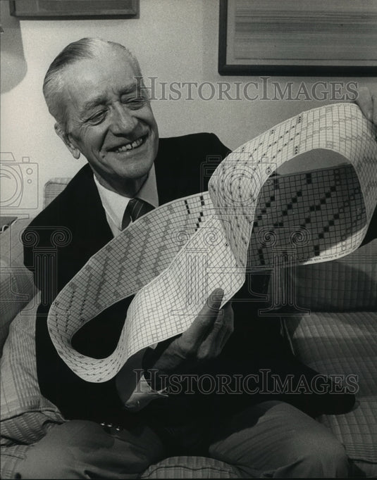 1988 Press Photo Robert M. Guilbert untwists his new game called Striptease- Historic Images