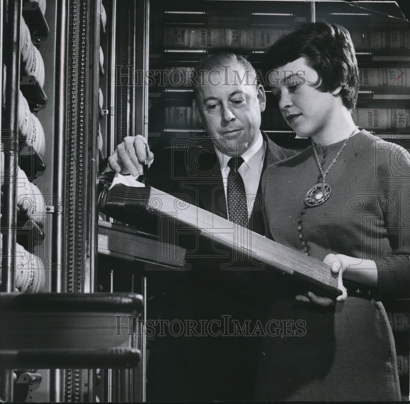 Load image into Gallery viewer, 1957 Press Photo Clerk of Circuit Court Francis X. McCormack with Karen Vogel
