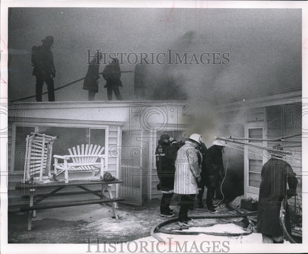 1963 Press Photo Firemen fight a blaze at a New Berlin house fire, Wisconsin