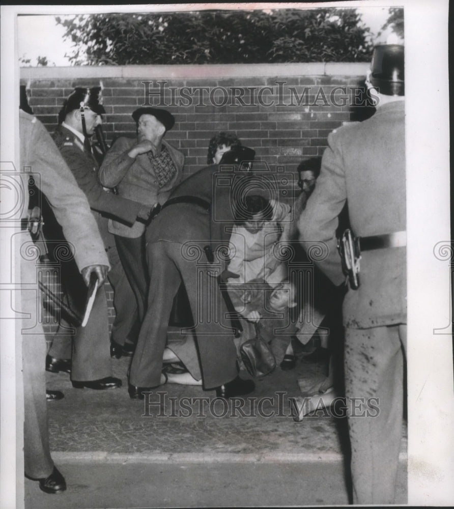 1955 Press Photo German Police Help Woman During Riot in West Berlin - mjb22808- Historic Images