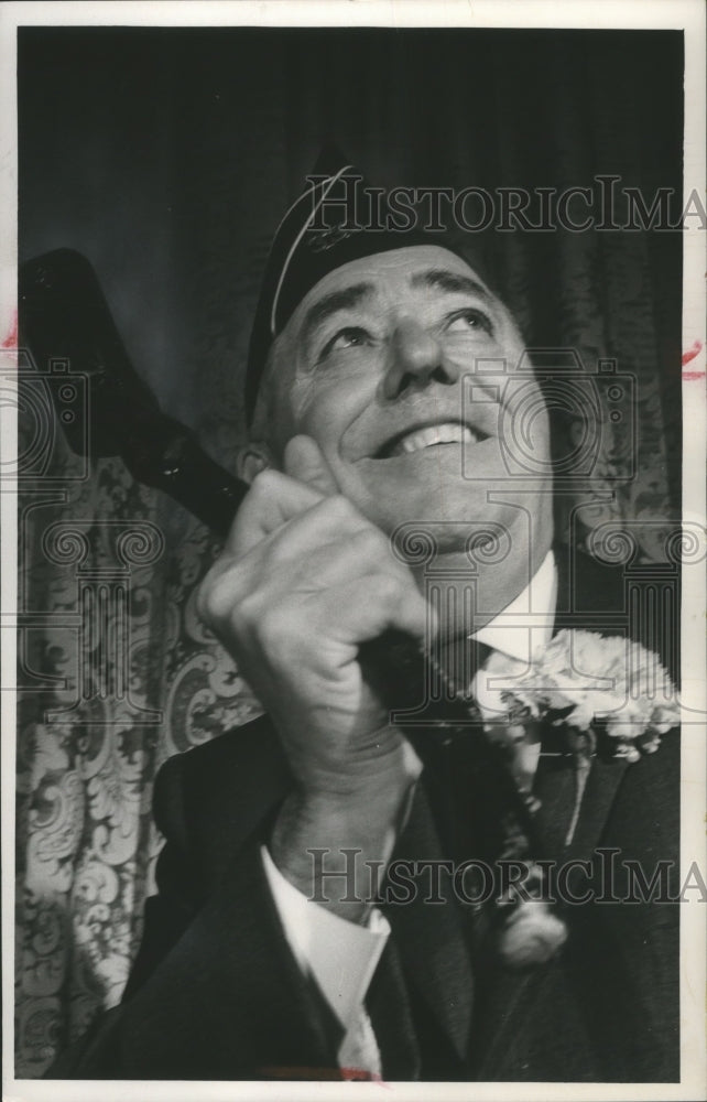 1964 Press Photo District Attorney William J. McCauley, holds a shillelagh.