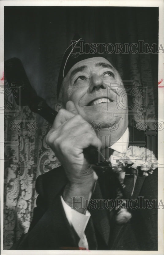 1964 Press Photo District Attorney William J. McCauley, holds a shillelagh.