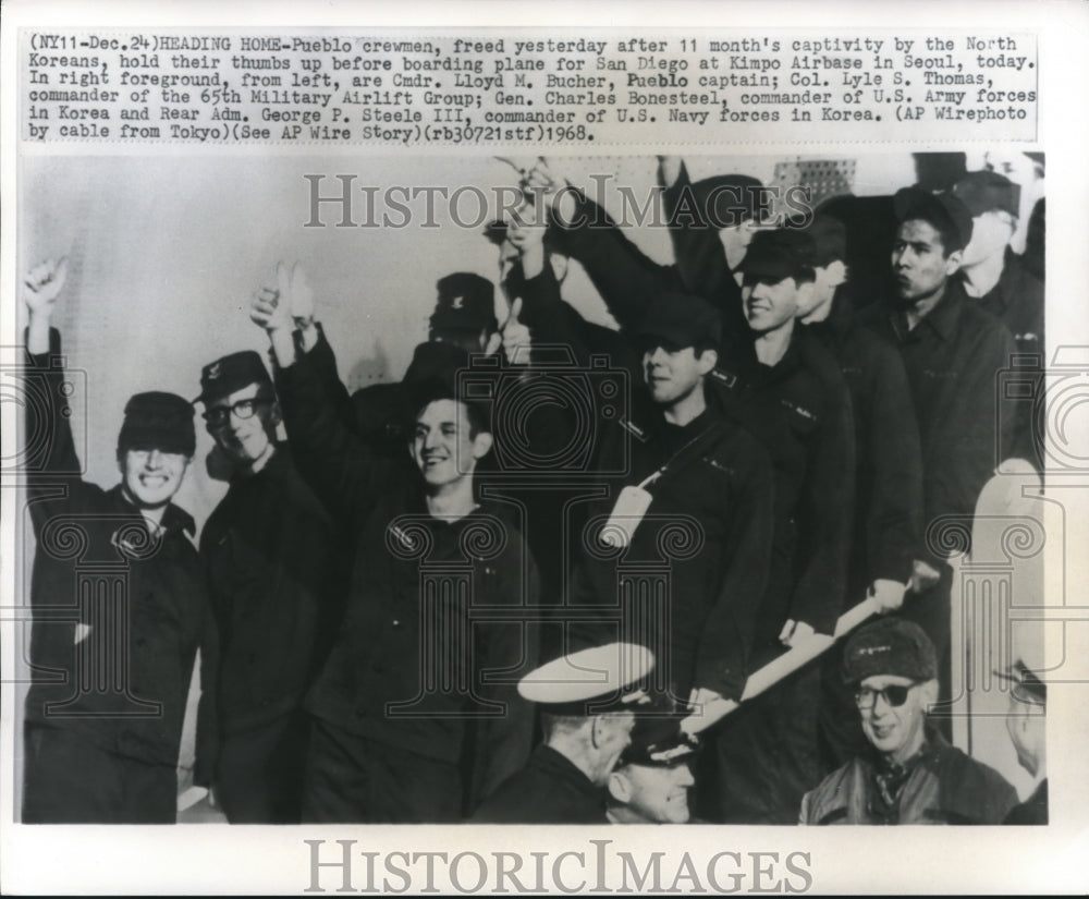 1968 Press Photo Pueblo crewman give thumbs up while boarding plane, Seoul