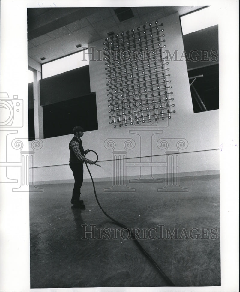 Load image into Gallery viewer, 1973 Press Photo Worker re-icing the ice rink at Mayfair Shopping Center
