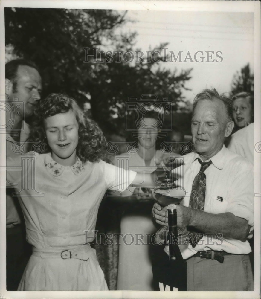 1951 Press Photo The young girl puts her hand in a flame of kerosene - mjb39720- Historic Images