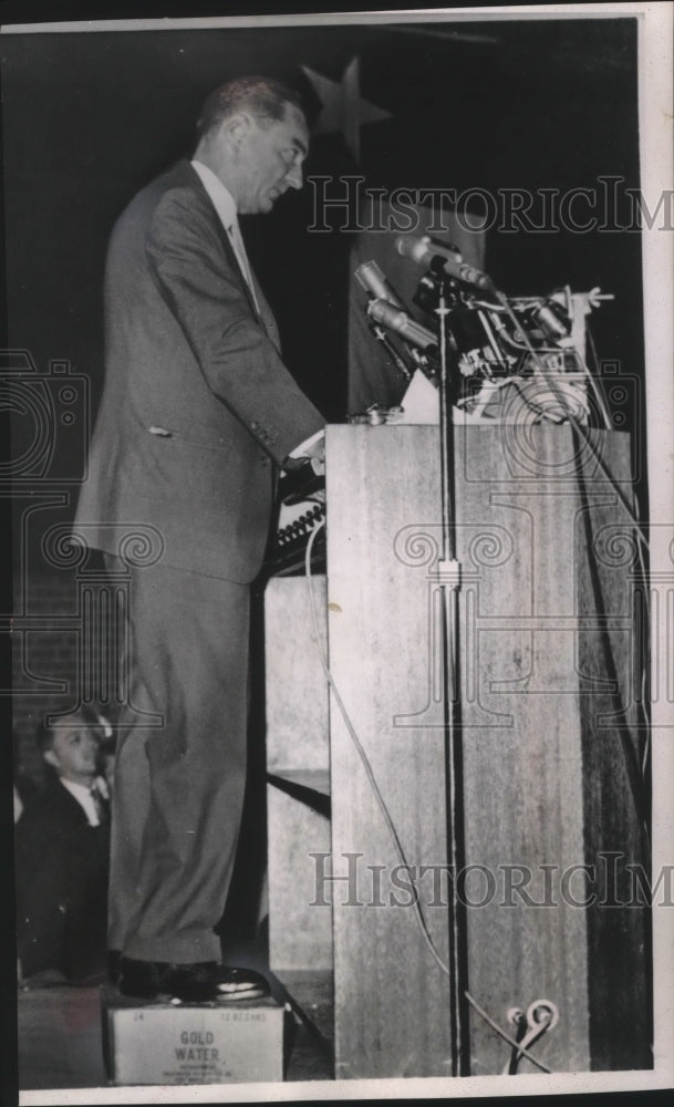 Load image into Gallery viewer, 1964 Press Photo Rep. William Miller stood on case of Gold Water soft drinks
