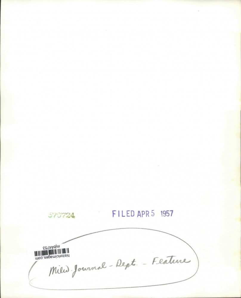 1957 Press Photo Milwaukee Journal employee at his desk in Feature Department