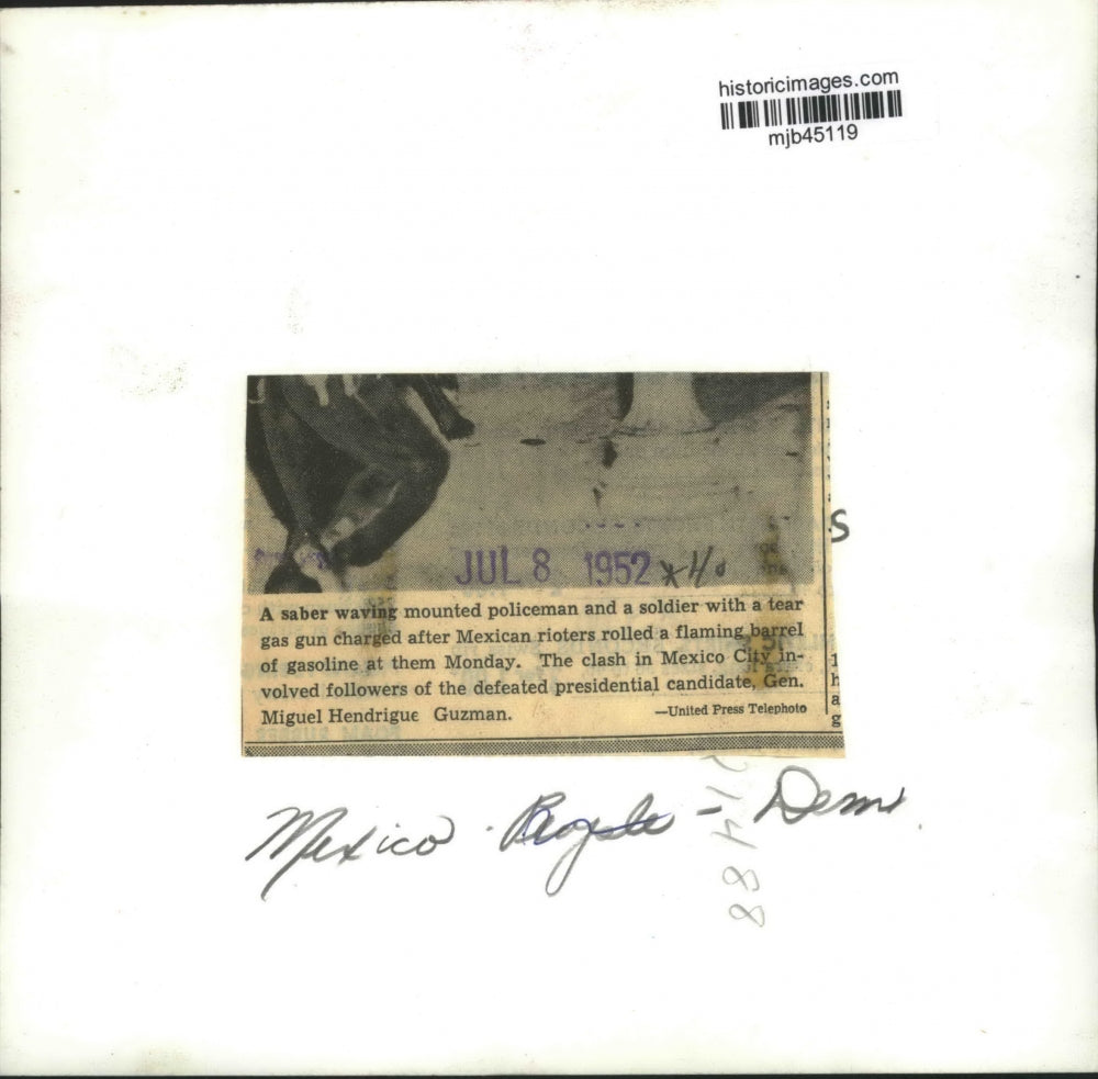 1952 Press Photo Mexican policeman and soldier charging Mexican rioters