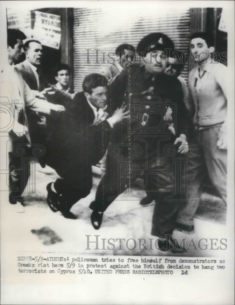 1956 Press Photo Rioters in Athens, Greece with a policeman - mjb46607- Historic Images