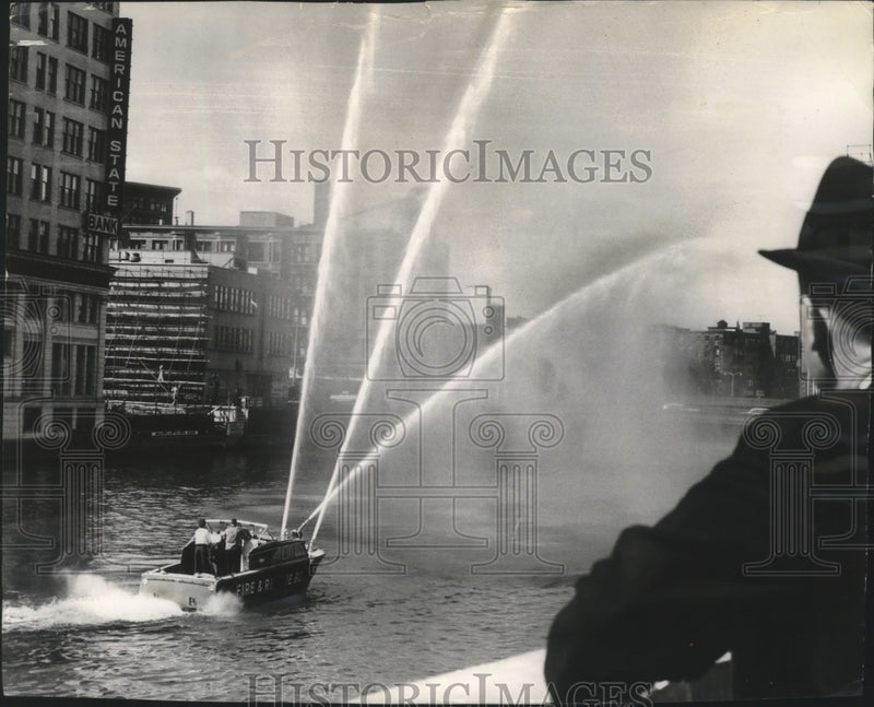 Load image into Gallery viewer, 1962 Press Photo Stream of water flow from fire boat on the Milwaukee river.

