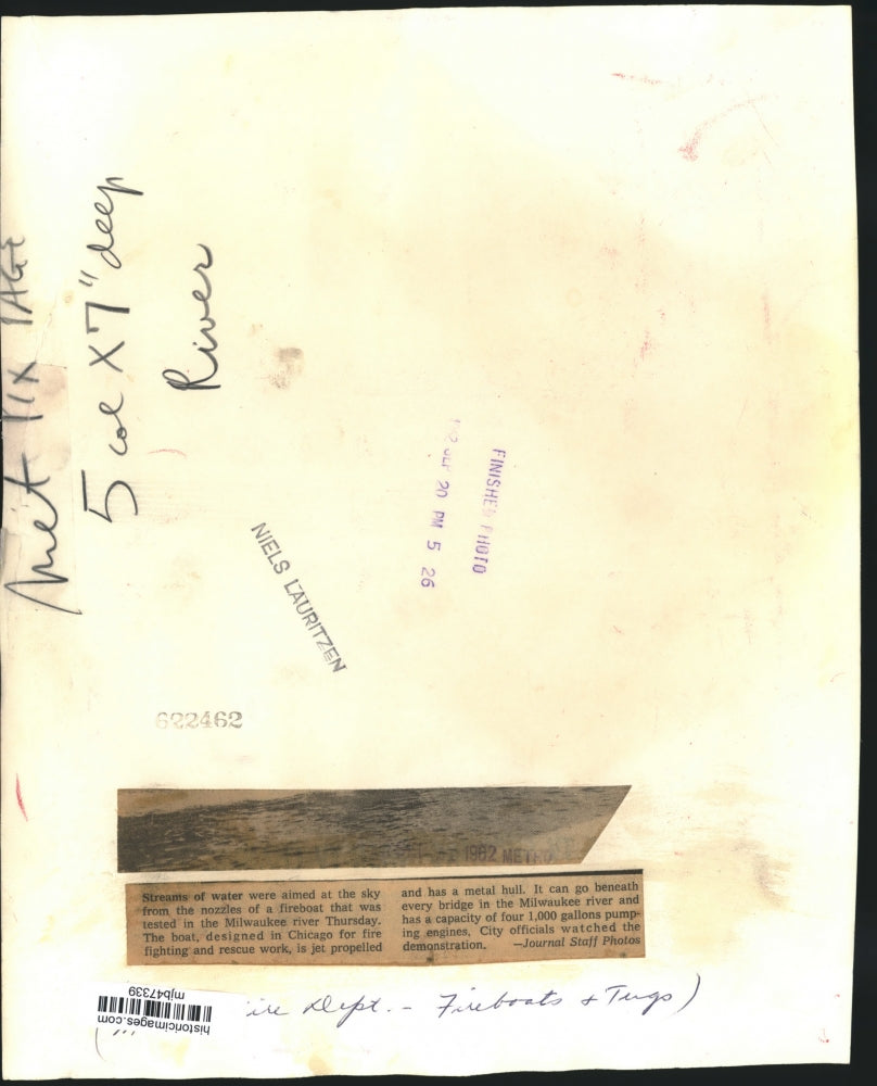 1962 Press Photo Stream of water flow from fire boat on the Milwaukee river.