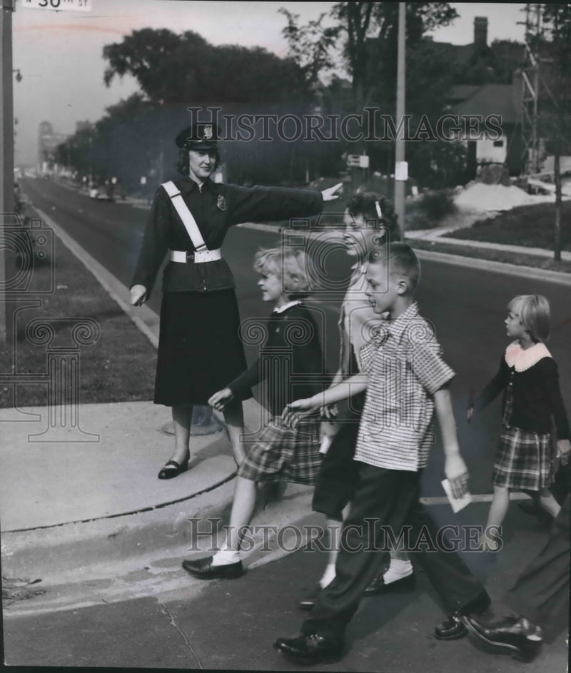 Load image into Gallery viewer, 1953 Press Photo June Kamine works as a crossing guard in Milwaukee, Wisconsin
