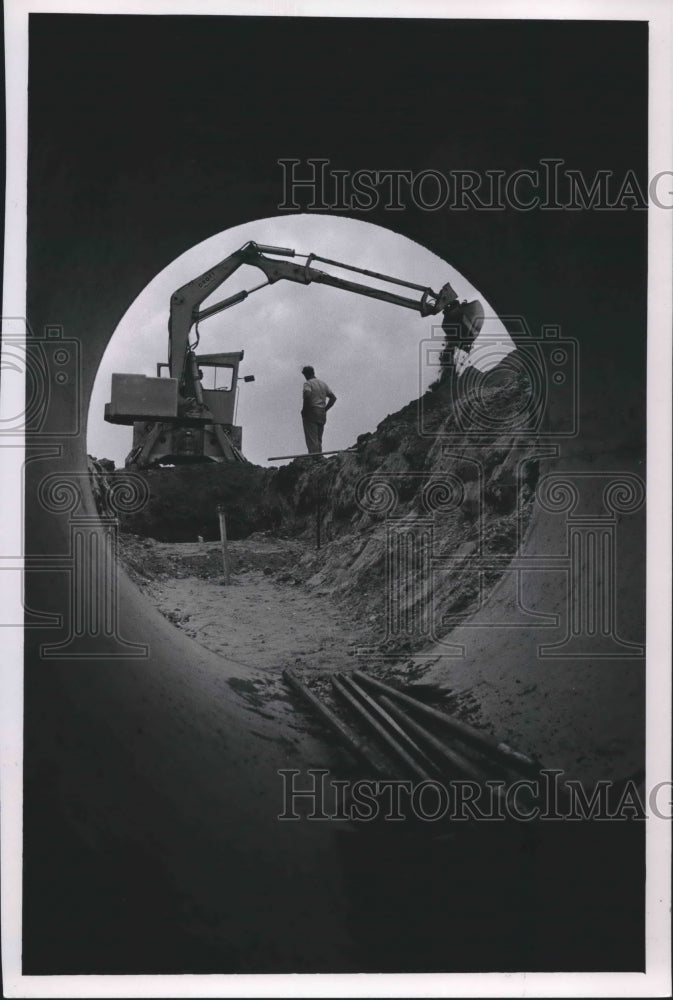 1968 Press Photo Culvert being cut n the clay soil near Angelo, Wisconsin.