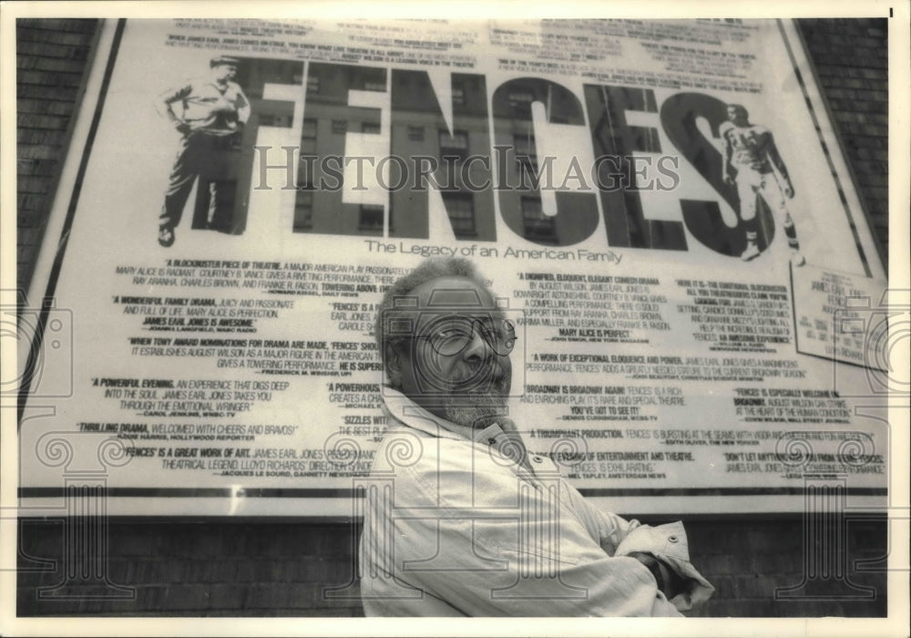 1987 Press Photo Fences director, Lloyd Richards, next to broadway advertisement- Historic Images