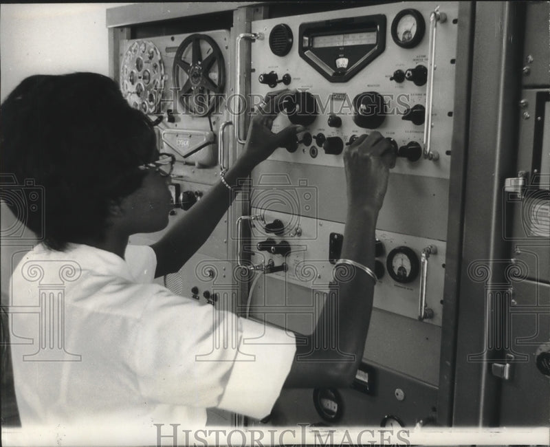Load image into Gallery viewer, 1965 Press Photo Radio Operator Does Her Chores At An Office In British Guyana
