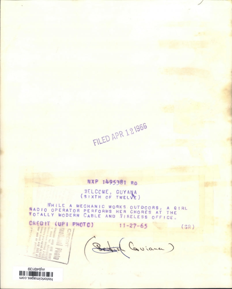 1965 Press Photo Radio Operator Does Her Chores At An Office In British Guyana