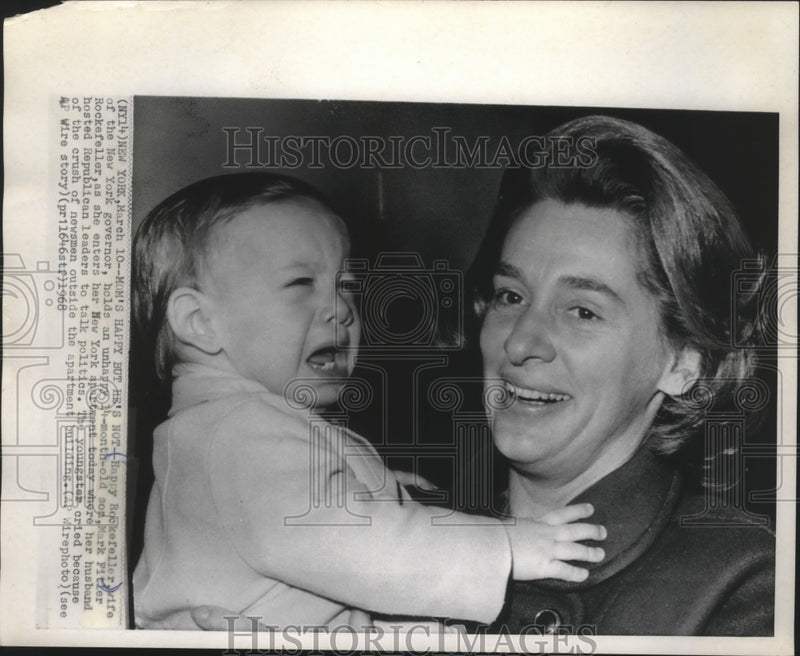 Load image into Gallery viewer, 1968 Press Photo Governor's wife, Mrs. Rockefeller holding her crying son, Mark
