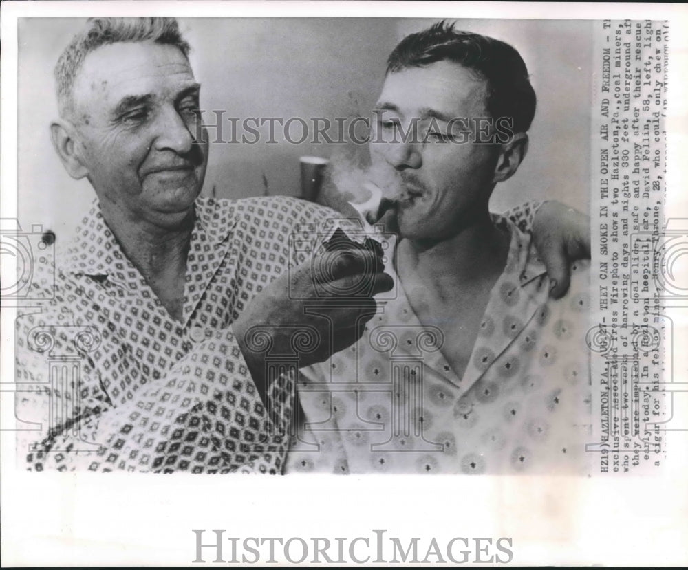 1963 Press Photo David Fellin and Henry Throne light up a cigar in Pennsylvania