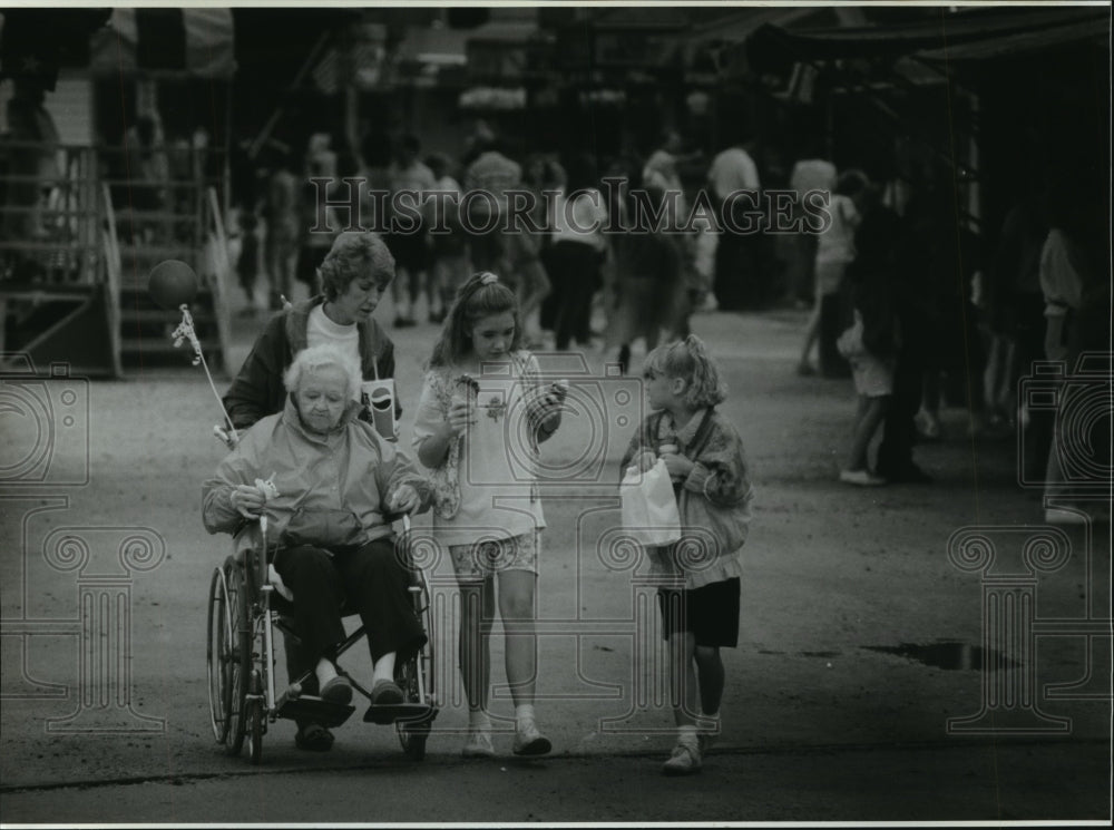 1994 Press Photo Lillian Rau and family on the midway at the fair, Cedarburg.- Historic Images