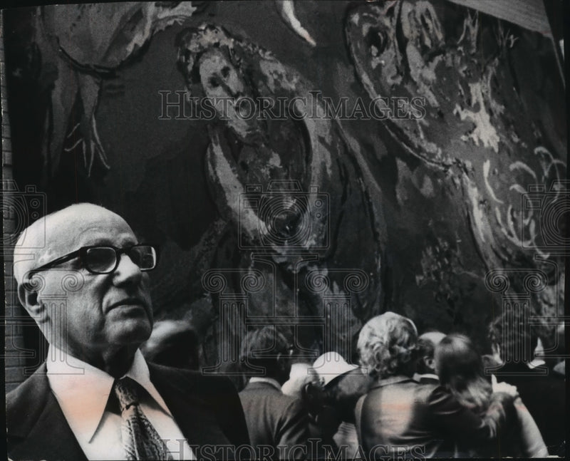 Load image into Gallery viewer, 1973 Press Photo Evan Helfaer standing next to Marc Chagall tapestry, Milwaukee.
