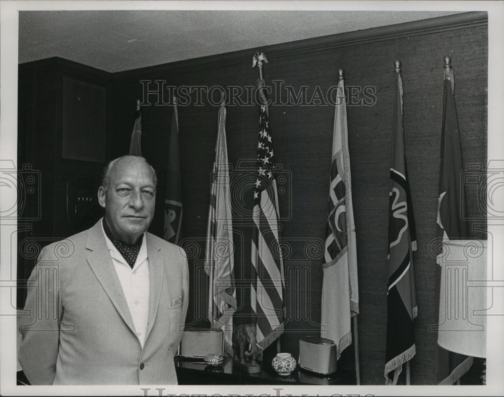 1968 Press Photo Former General Paul D. Harkins by flags he served under.