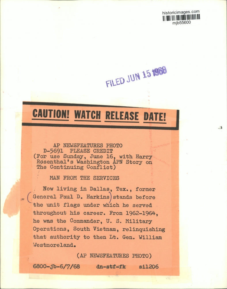 1968 Press Photo Former General Paul D. Harkins by flags he served under.