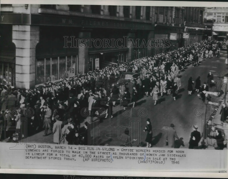 Load image into Gallery viewer, 1946 Press Photo Boston office workers walk around crowd lined up for stockings
